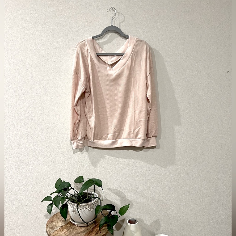 Long sleeve, V-neck waffle shirt.